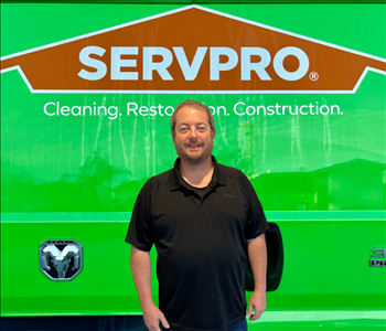 tech in front of Servpro van