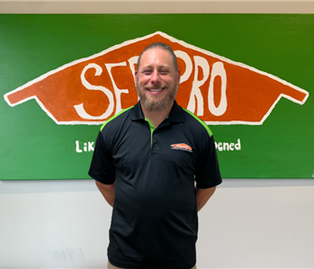 Man in front of SERVPRO Sign