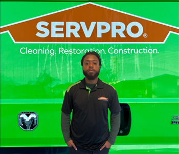 tech in front of Servpro van