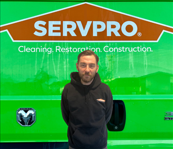 tech in front of SERVPRO van