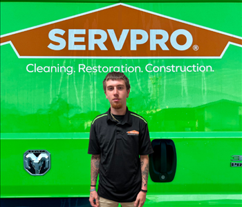 tech in front of Servpro van