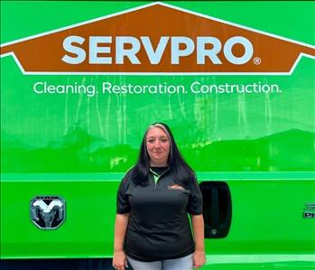 tech in front of Servpro van