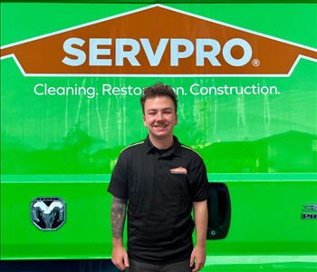 tech in front of Servpro van