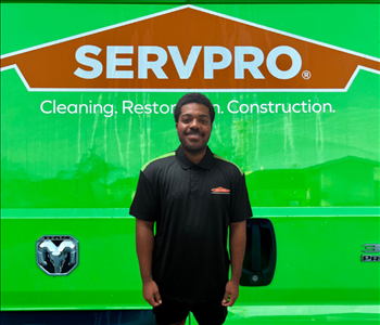 tech in front of Servpro van