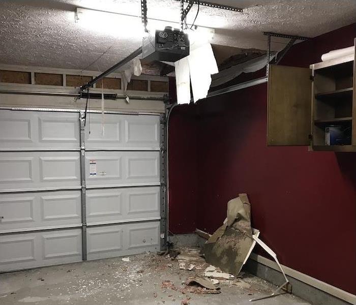 garage with ceiling damaged and falling down